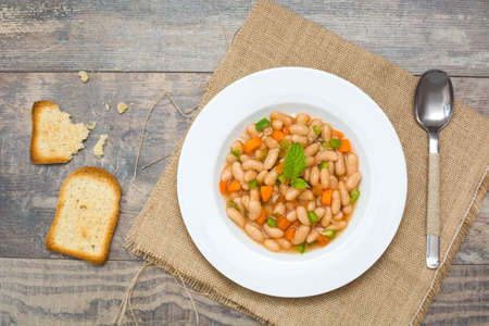 white beans with carrot and green pepperの写真素材