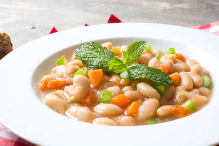 white beans with carrot and green pepperの写真素材