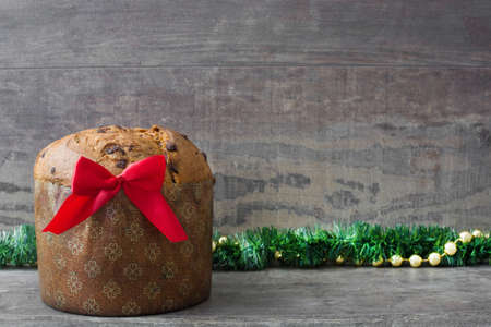 Panettone with chocolate on a wood tableの写真素材