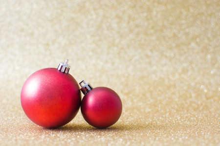 Christmas balls and golden backgroundの写真素材