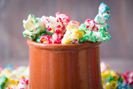 Sweet popcorn on wood