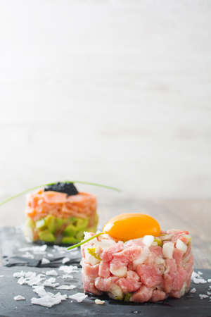 Steak tartare and salmon tartareの写真素材