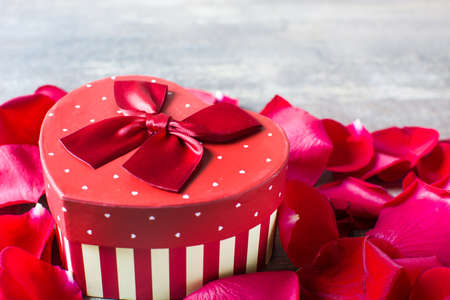 Gift box with heart shape and petals