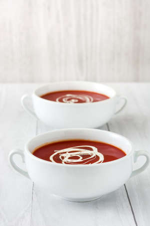 tomato soup on white wood