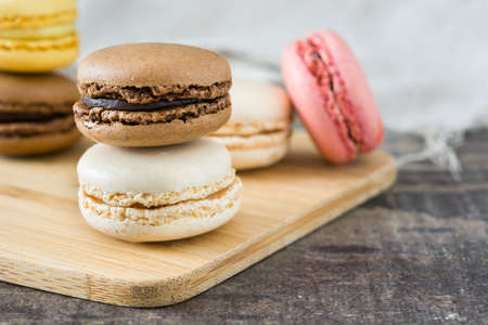 colorful macarons on woodの写真素材