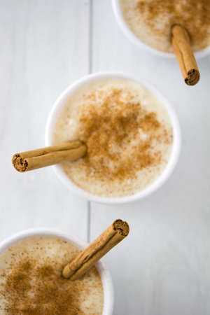 Rice pudding on white woodの写真素材