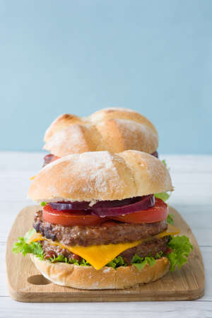 Homemade burgers. Blue background.の写真素材