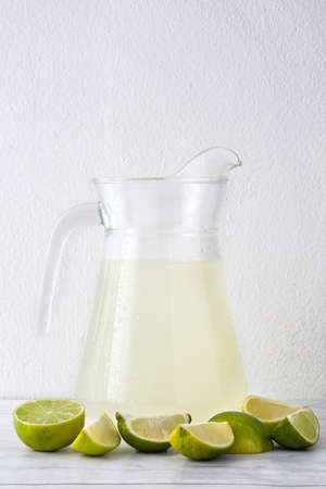 Fresh lime juice on white wood