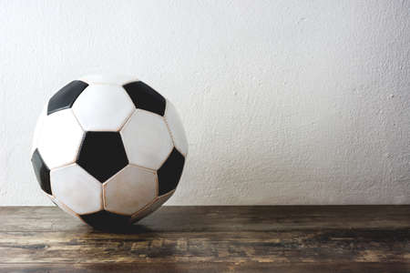 Old Soccer football on woodの写真素材