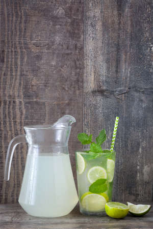 Summer drink. Fresh mojito on a rustic wood