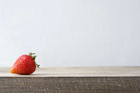 Delicious strawberry smoothie on a rustic woodの写真素材