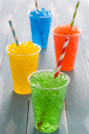 Colorful summer blue slushies on woodの写真素材
