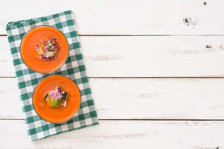 Gazpacho soup in glass on white wooden tableの写真素材
