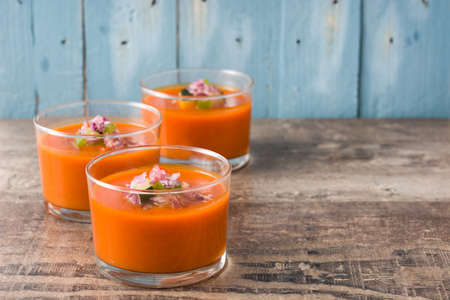 Gazpacho soup in glass on rustic woodの写真素材