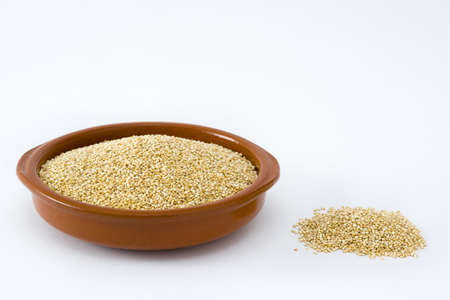 Quinoa in a bowl isolated on white backgroundの写真素材