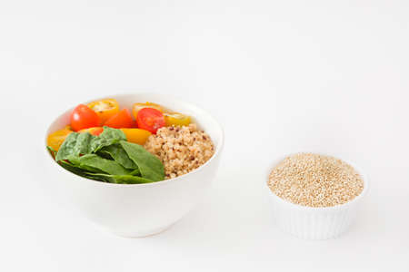Quinoa salad in a bowl isolated on white backgroundの写真素材