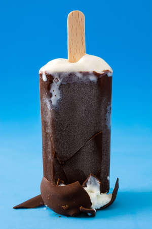 chocolate popsicle on blue backgroundの写真素材