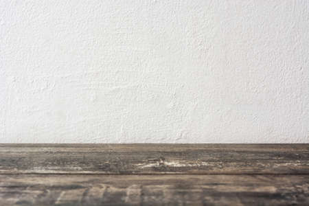 Rustic wooden floor and white wall
