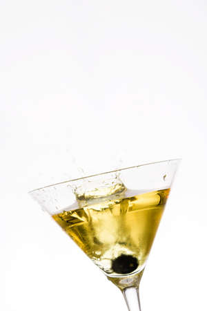 Yellow cocktail splash on white backgroundの写真素材
