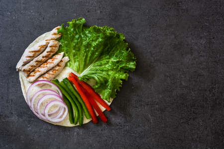 Mexican fajitas ingredients on slate backgroundの写真素材