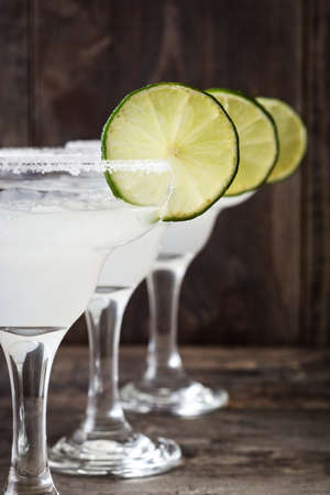 Margarita cocktail on a rustic wooden backgroundの写真素材