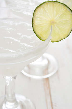 Margarita cocktail on a white wooden tableの写真素材