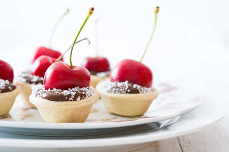 Delicious chocolate with cherry tartletsの写真素材