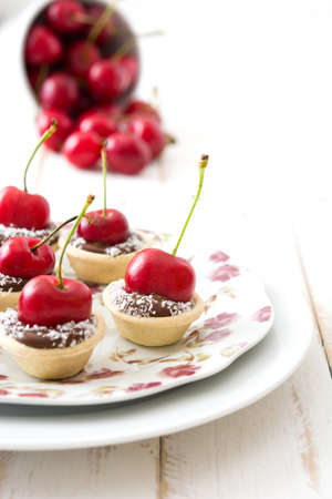 Delicious chocolate with cherry tartletsの写真素材