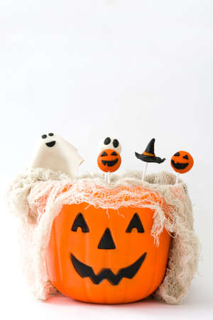 Halloween cake pops in a basket with pumpkin shapeの写真素材