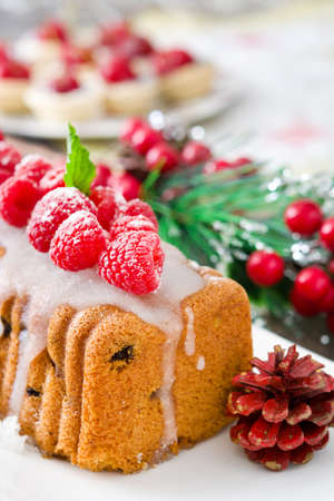 Christmas fruit cake on a rustic wooden tableの写真素材