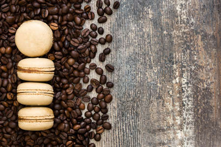 French coffee macaroons on a rustic wooden backgroundの写真素材