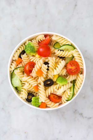 Pasta salad on marble backgroundの写真素材