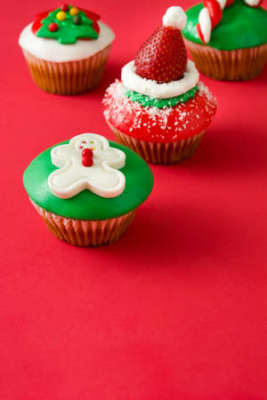 Christmas cupcake on red backgroundの写真素材