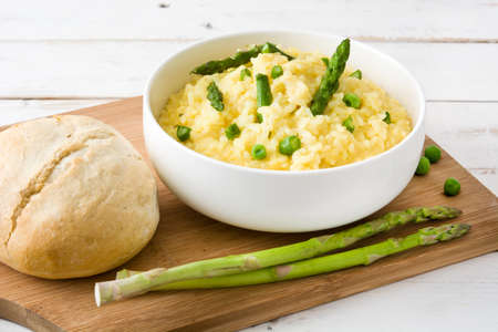 Risotto with asparagus on white wooden tableの写真素材