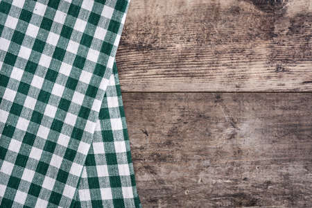 Green tablecloth and rustic wooden backgroundの写真素材