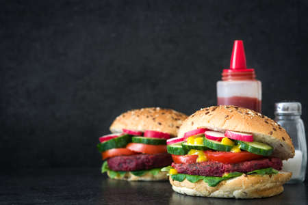 Veggie burger beet on black slate backgroundの写真素材