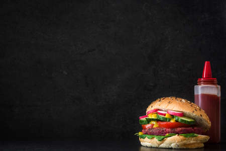 Veggie burger beet on black slate backgroundの写真素材