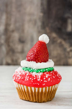 Santa hat cupcake on wooden backgroundの写真素材