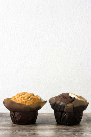 Variety of muffins on a wooden tableの写真素材