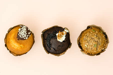 Variety of muffins on brown backgroundの写真素材