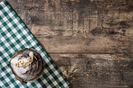 Muffin and checkered tablecloth on rustic wooden backgroundの写真素材