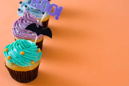 Halloween cupcakes on orange backgroundの写真素材