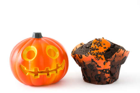 Halloween and pumpkin muffin isolated on white backgroundの写真素材