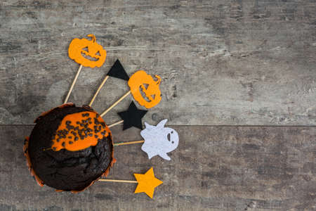 Halloween muffin on rustic wooden backgroundの写真素材