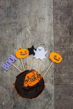 Halloween muffin on rustic wooden backgroundの写真素材