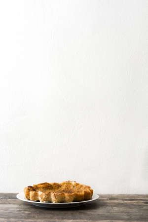 Homemade pumpkin pie on wooden backgroundの写真素材