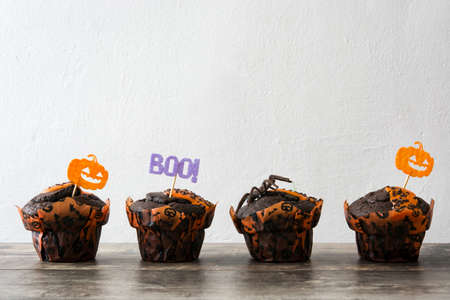 Halloween muffins on a wooden tableの写真素材