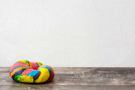 Colorful bagel on a wooden tableの写真素材