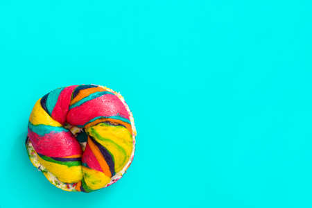 Colorful bagel on blue backgroundの写真素材