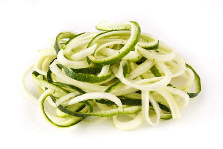 Delicious zucchini noodles isolated on white backgroundの写真素材